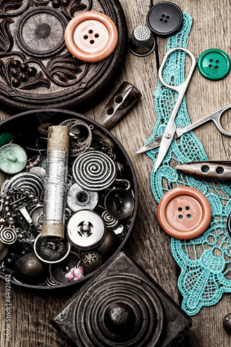 buttons and zipper on the background of sewing tool