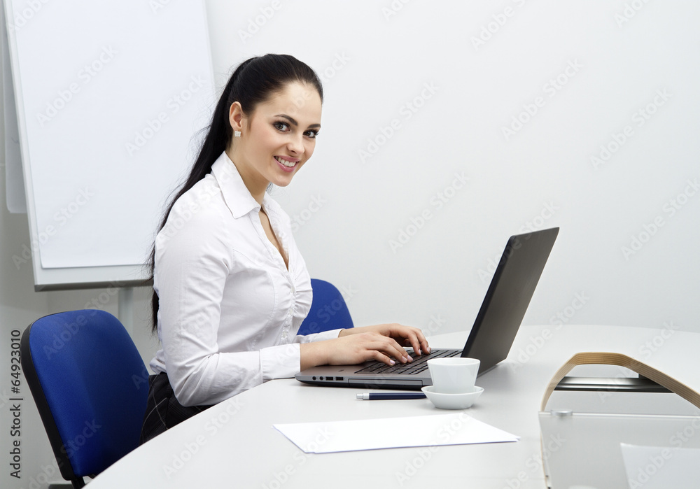 attractive young business woman working with computer in office attractive young business woman working with computer in office