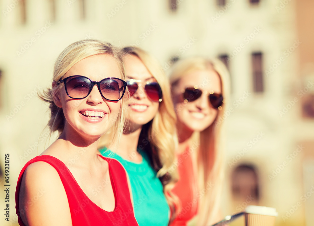 women with takeaway coffee cups in the city women with takeaway coffee cups in the city