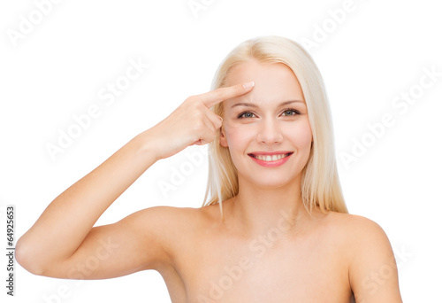 beautiful woman touching her forehead