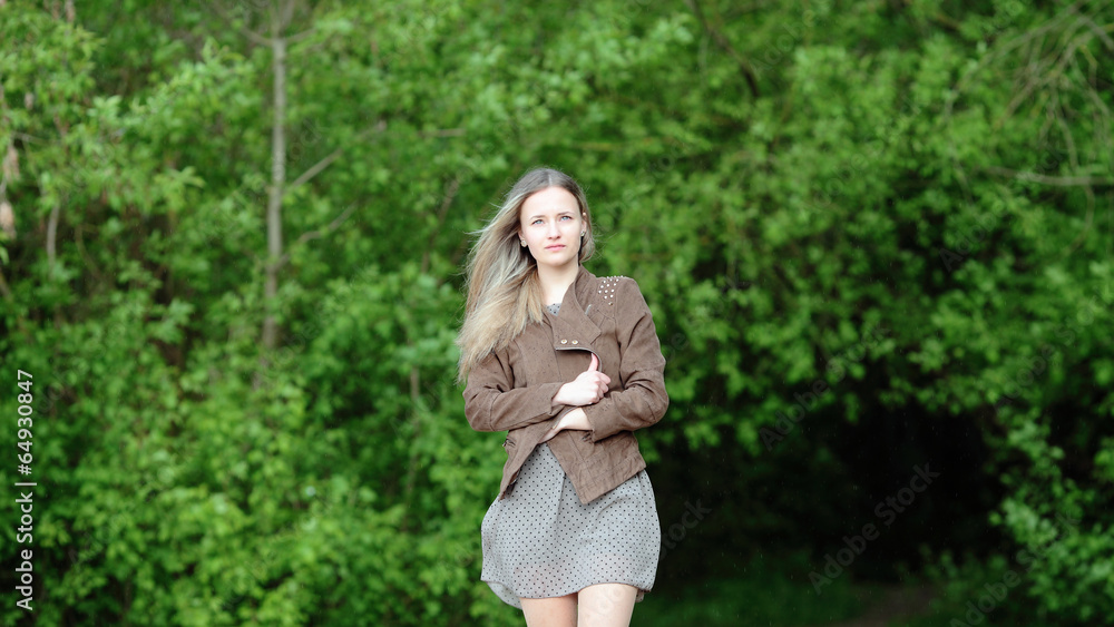 Young girl goes out of the forest Young girl goes out of the forest