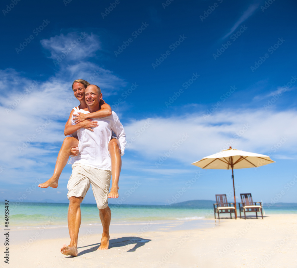 A couple walking on the beach