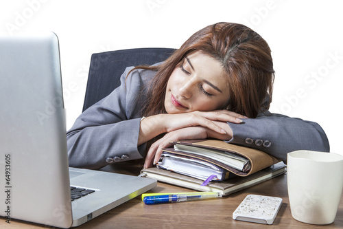 Young business woman sleeping at workplace
