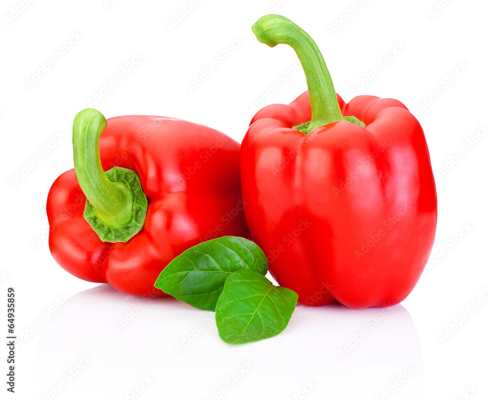 Two Sweet Red Peppers with green leaves isolated on white backgr Two Sweet Red Peppers with green leaves isolated on white backgr