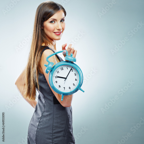 Portrait of business woman holding watch.