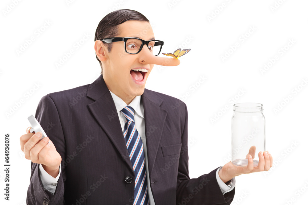 Businessman with butterfly on his nose holding a jar Businessman with butterfly on his nose holding a jar