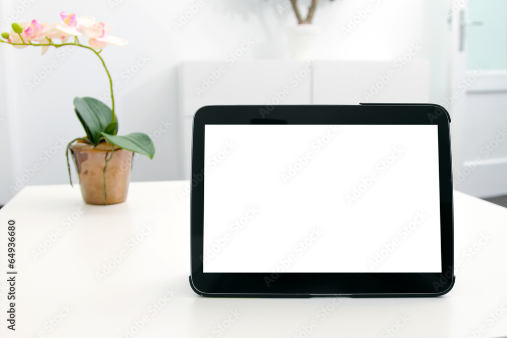 blank digital tablet on the table in the room blank digital tablet on the table in the room
