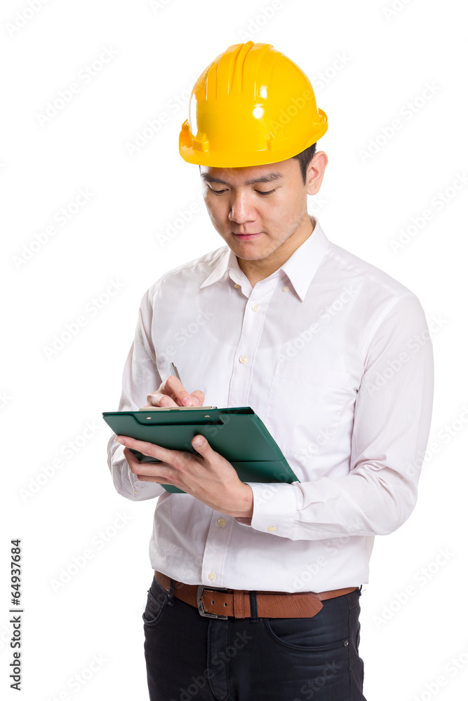 Asia engineer recording something on clipboard Asia engineer recording something on clipboard