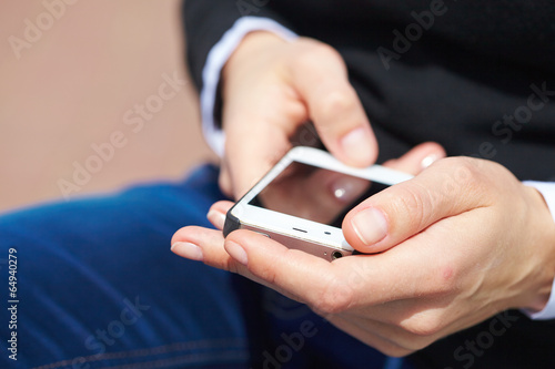 woman's hands with mobile phone