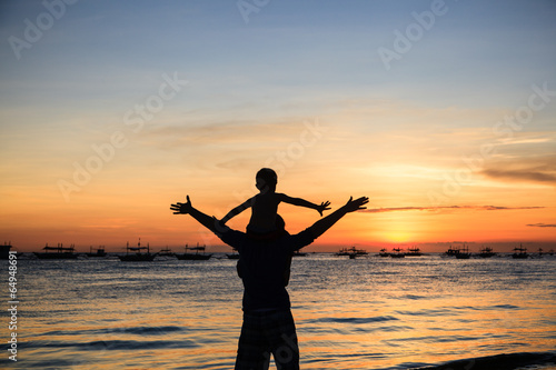 happy family on sunset beach