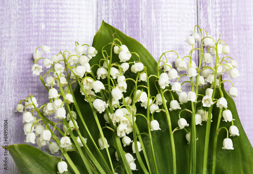 Fototapeta Naklejka Na Ścianę i Meble -  Beautiful lilies of the valley on wooden background