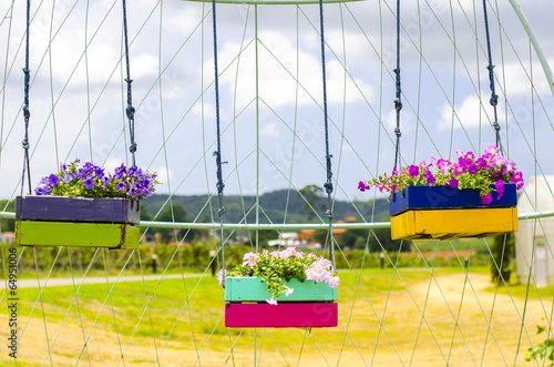 Fototapeta Naklejka Na Ścianę i Meble -  Hanging Flower Pots in garden
