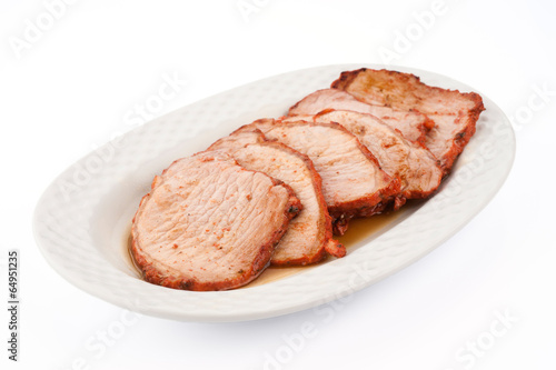 freshly cooked loin steaks marinated in porcelain tray