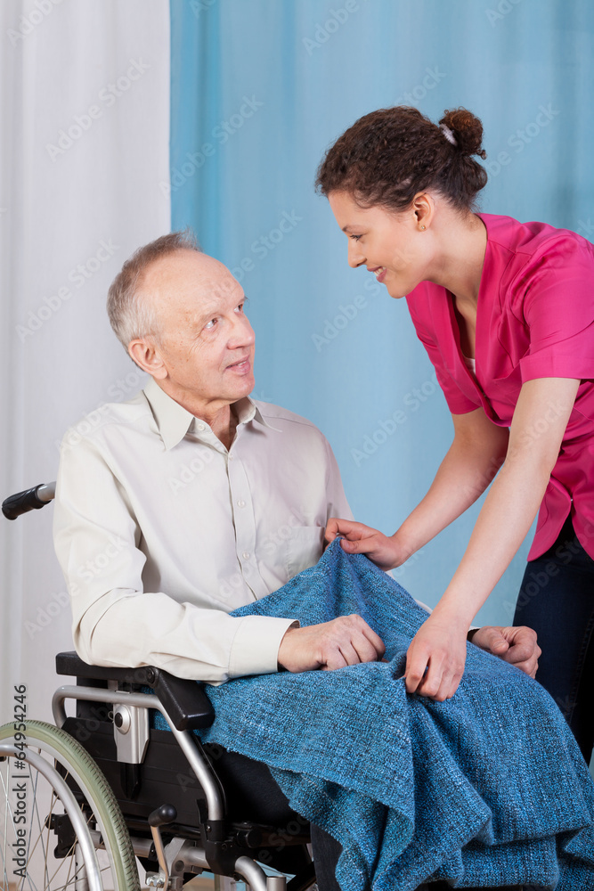 Nurse caring about disabled man Nurse caring about disabled man