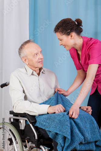 Nurse caring about disabled man