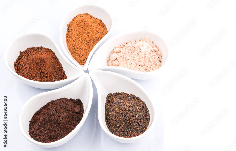 Cocoa powder, dried tea leaves and grounded coffee in ceramic Cocoa powder, dried tea leaves and grounded coffee in ceramic