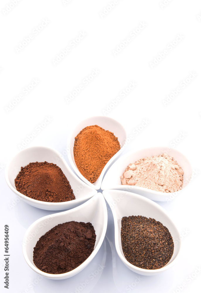 Cocoa powder, dried tea leaves and grounded coffee in ceramic Cocoa powder, dried tea leaves and grounded coffee in ceramic