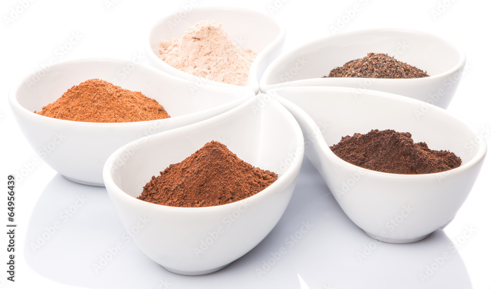 Cocoa powder, dried tea leaves and grounded coffee in ceramic Cocoa powder, dried tea leaves and grounded coffee in ceramic