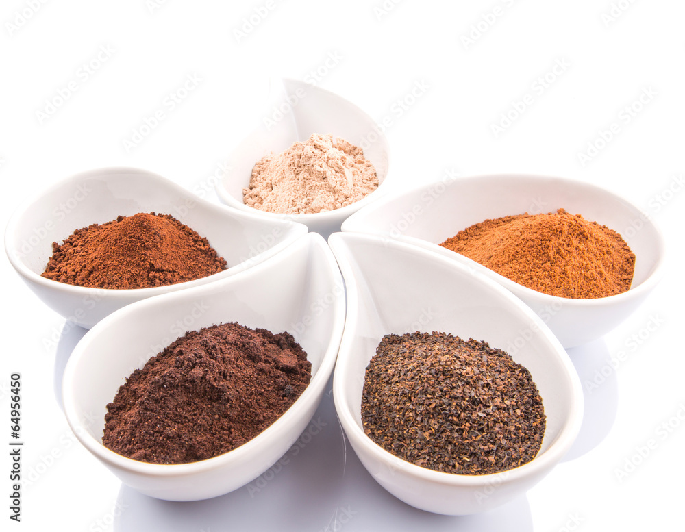 Cocoa powder, dried tea leaves and grounded coffee in ceramic Cocoa powder, dried tea leaves and grounded coffee in ceramic