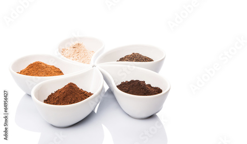 Cocoa powder, dried tea leaves and grounded coffee in ceramic