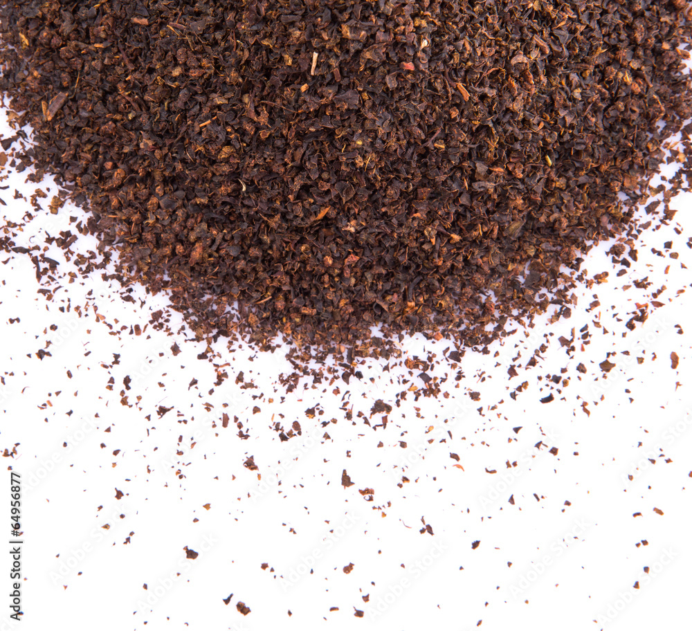 Dried tea leaves over white background Dried tea leaves over white background