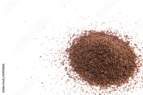 Dried tea leaves over white background