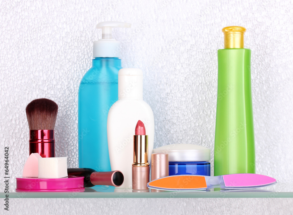 Shelf with cosmetics and toiletries in bathroom Shelf with cosmetics and toiletries in bathroom