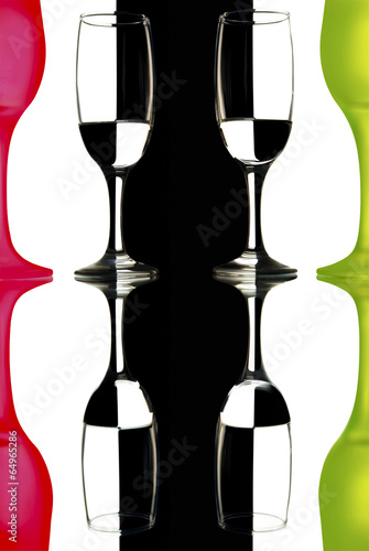 glass wine glasses on black and white background with reflection