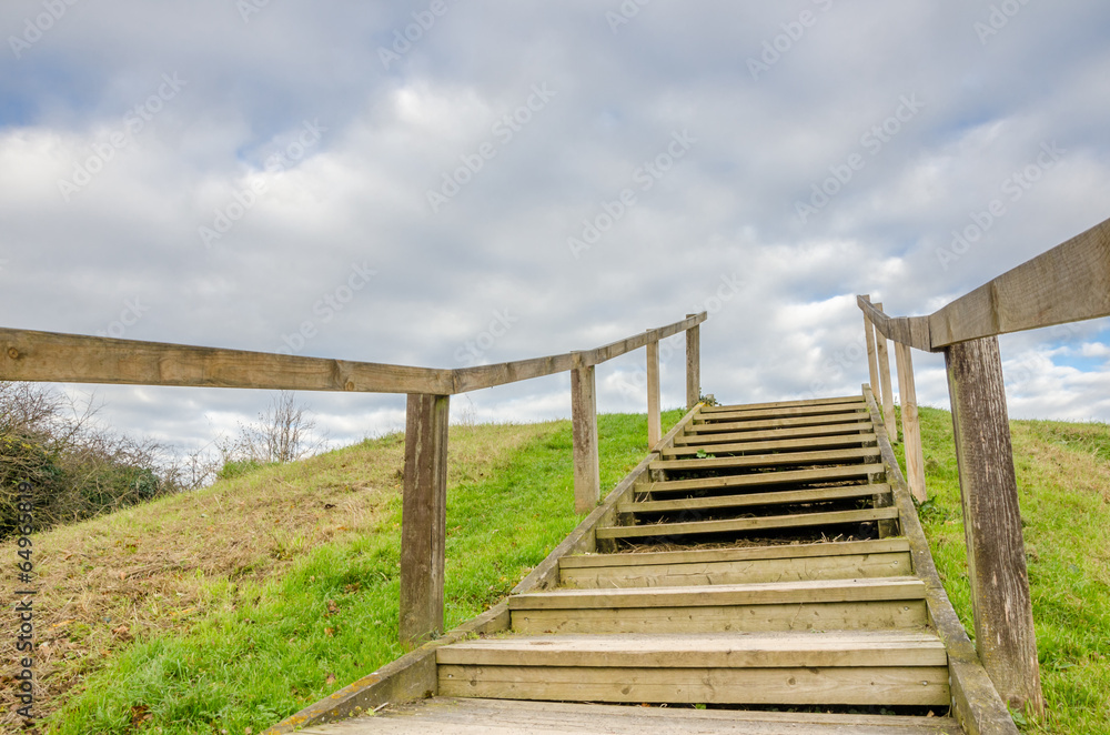 Wooden Staircase on the Hillside and Cloudy Sky