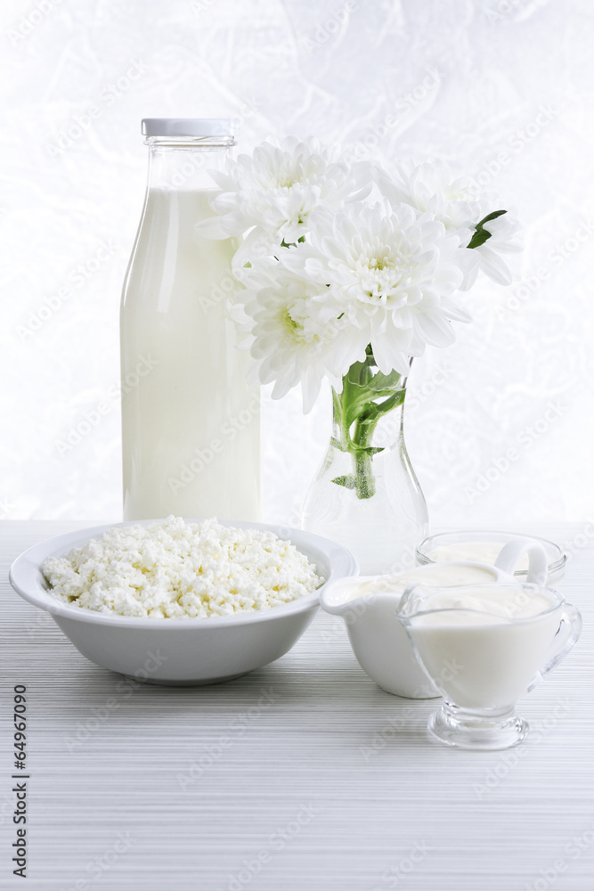 Tasty dairy products on wooden table