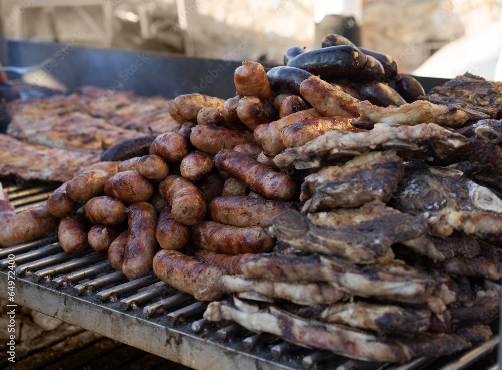 Fresh sausage and hot dogs grilling outdoors Fresh sausage and hot dogs grilling outdoors