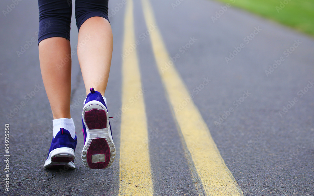 Runner Female Feet Running on Road. Jog