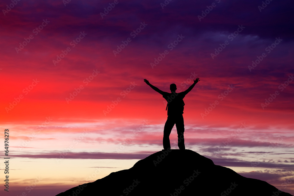 Silhouette of a man on a mountain top. Person silhouette on the