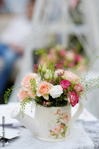 Watering can with roses