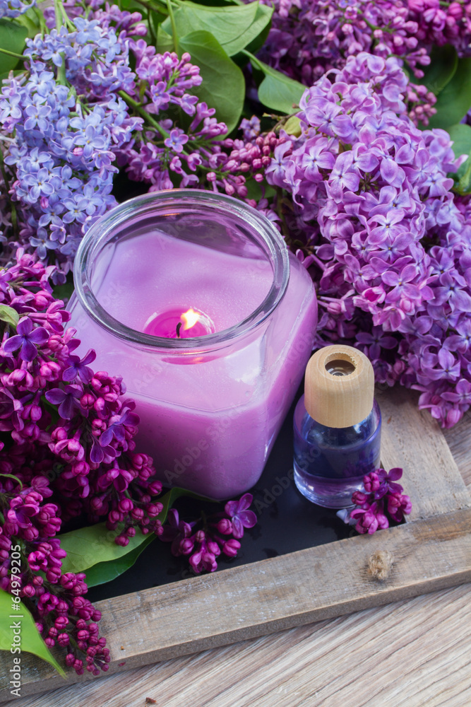 fresh lilac flowers with candle fresh lilac flowers with candle