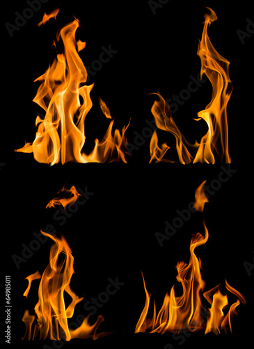 collection of four yellow flames isolated on black