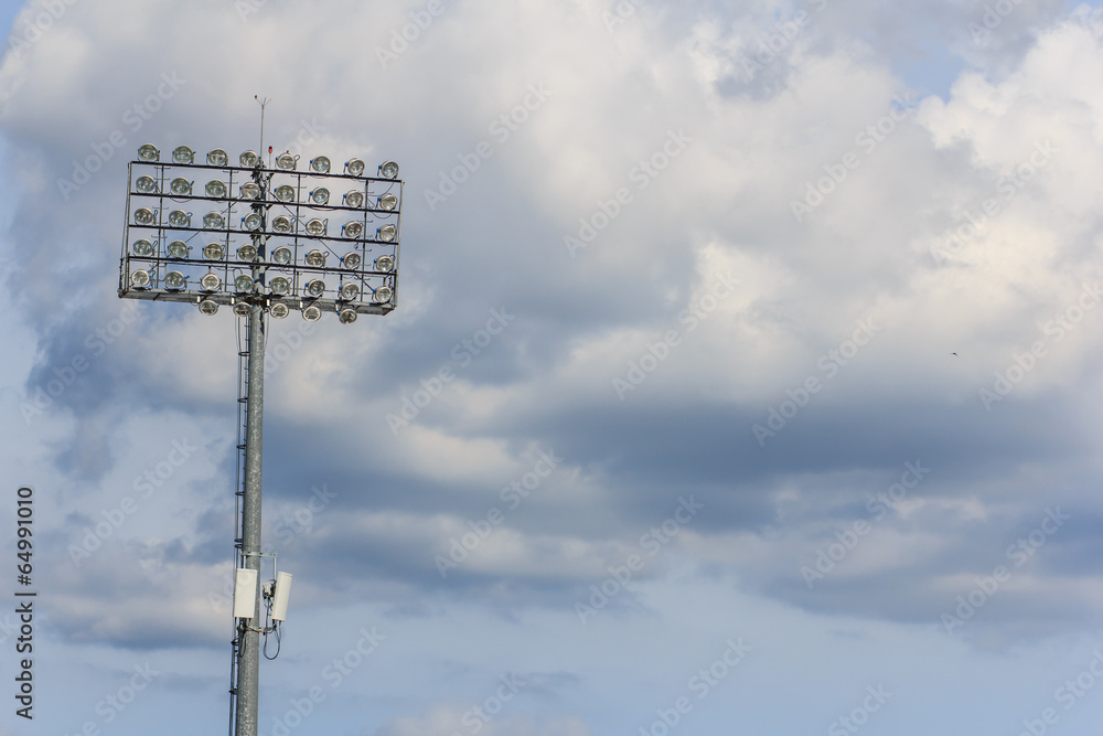 Spotlight pole blue sky cloud