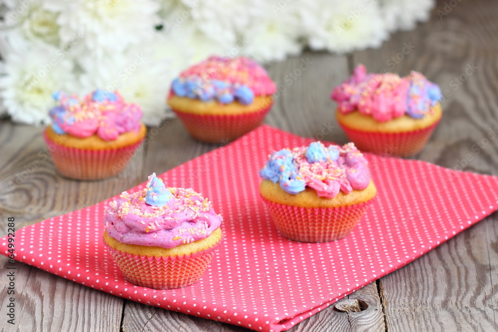 Bright colored muffins with flowers
