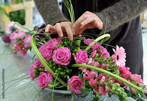Florist makes flowers bouquet