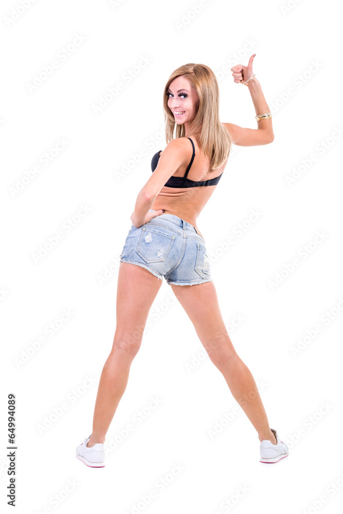 Pretty woman posing in sexy jeans shorts. Isolated on white Pretty woman posing in sexy jeans shorts. Isolated on white