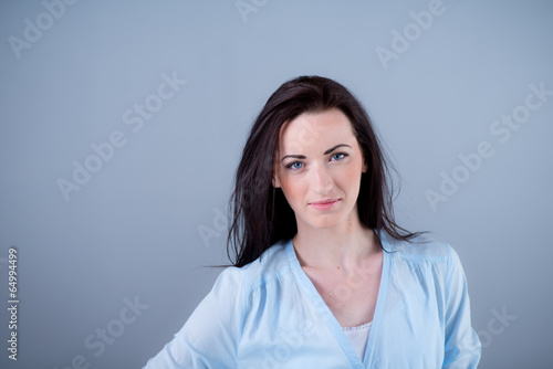 Isolated studio portrait of cheerful young woman