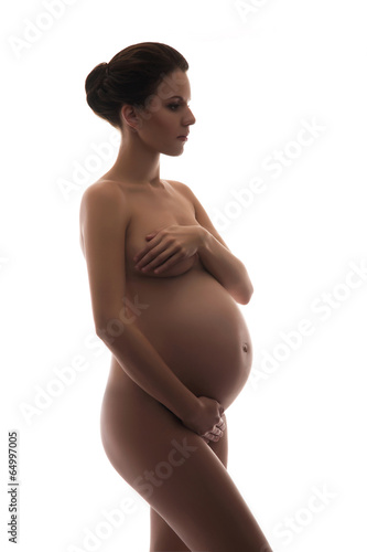 Naked pregnant woman with a beautiful belly