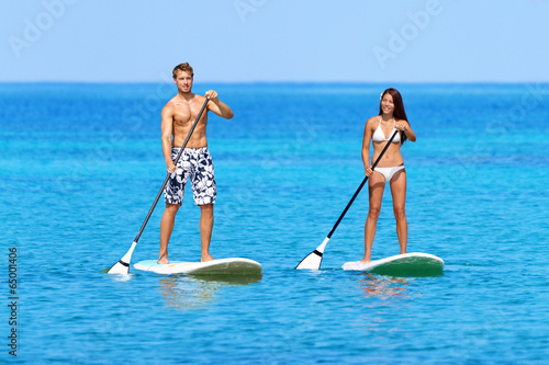 Stand up paddleboard beach people on paddle board