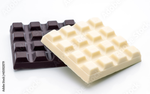 blocks of black and white chocolate isolated on white