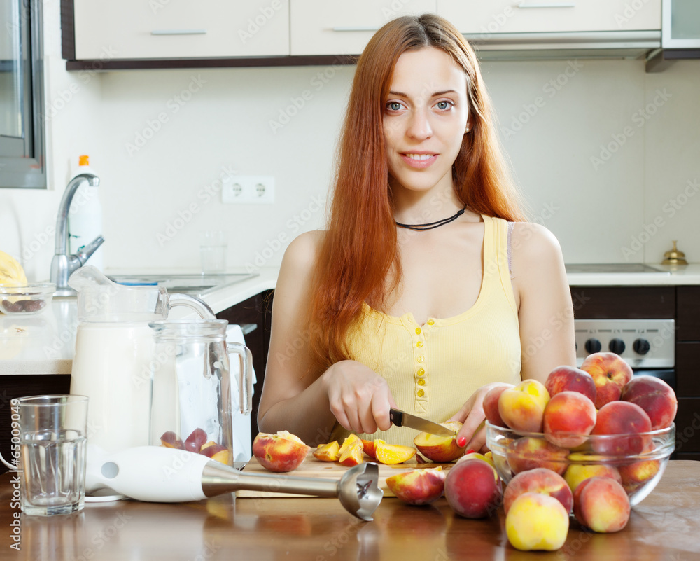 long-haired girl in yellow cooking with peaches