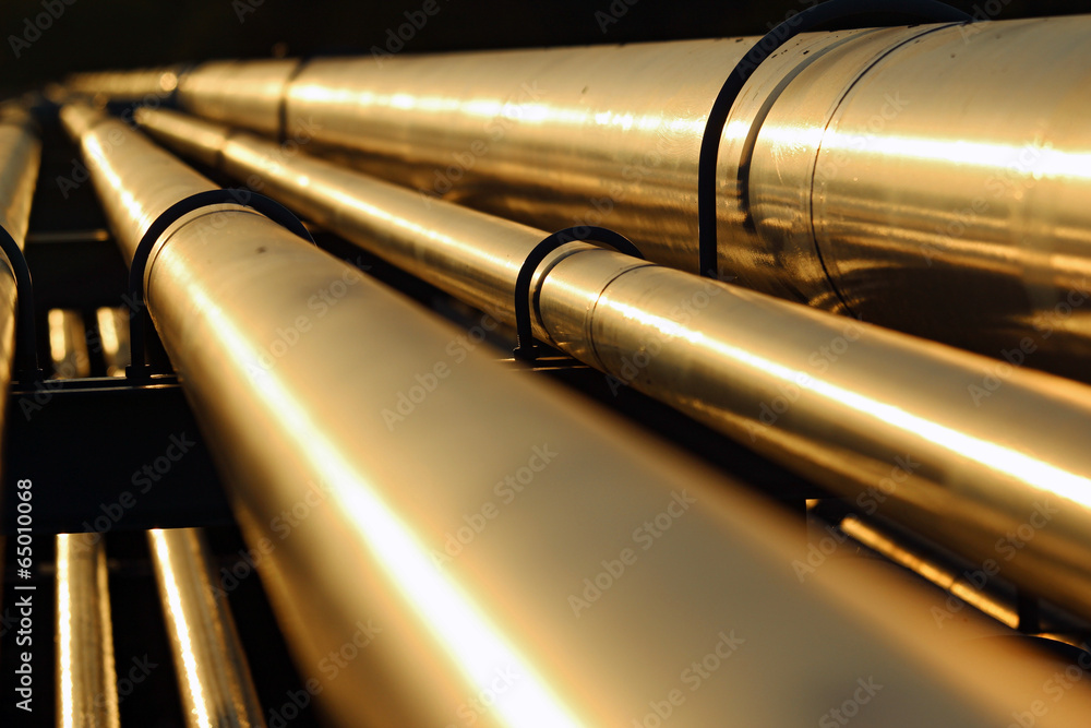 golden steel pipeline during sunset golden steel pipeline during sunset