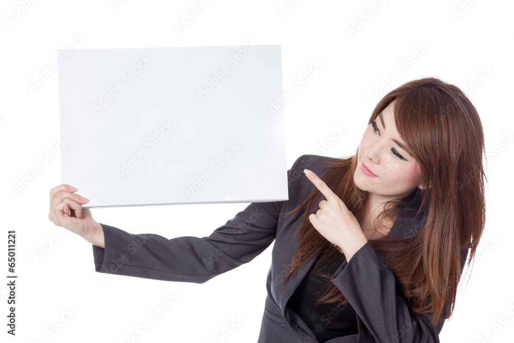 Asian businesswoman point and look at a blank sign Asian businesswoman point and look at a blank sign