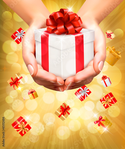 Holiday background with hands holding gift boxes. Vector.