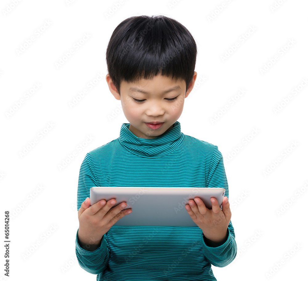 Little boy using digital tablet Little boy using digital tablet