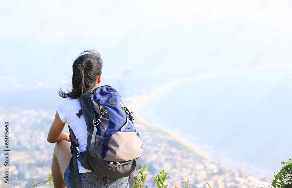 hiking woman enjoy the beautiful view at mountain peak